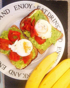 avocado and poached egg on toast with grilled tomatoes