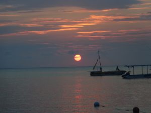 Picture of late evening Jamaican sunset with a boat